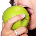 biting an apple