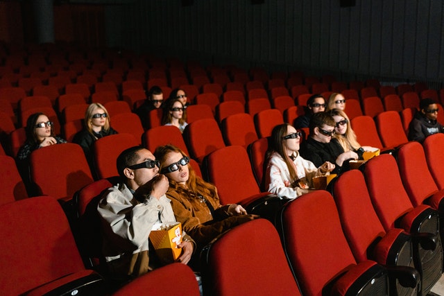 Students watching 3D movie in the cinema.